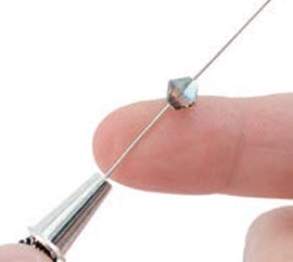 Bead getting threaded on